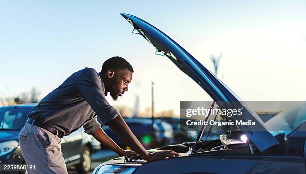 stressed man looking at car engine after breakdown - unexpected accident stock pictures, royalty-free photos & images
