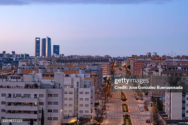 madrid skyline at twilight showing cuatro torres business area - empty street stock pictures, royalty-free photos & images
