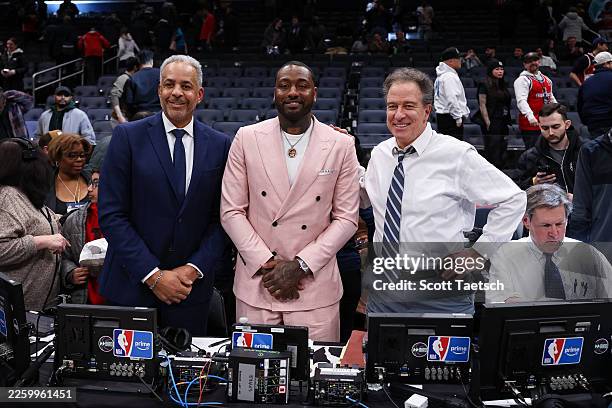 Dell Curry, retired NBA player John Wall, and Kevin Harlan look on after the game between the Washington Wizards and the Milwaukee Bucks at Capital...
