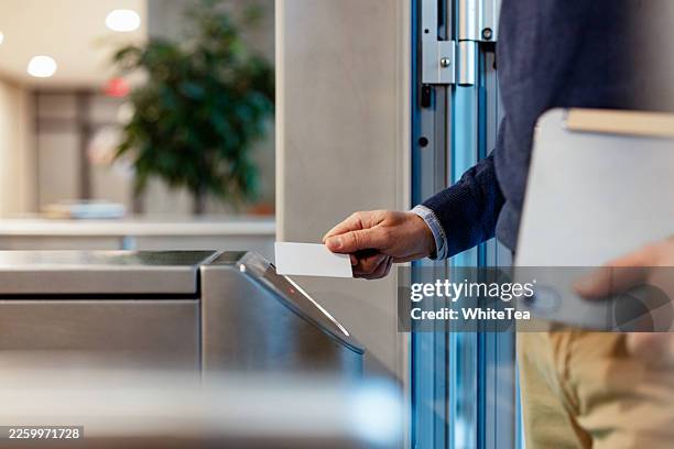 business professional swiping card at access door - smart card stock pictures, royalty-free photos & images