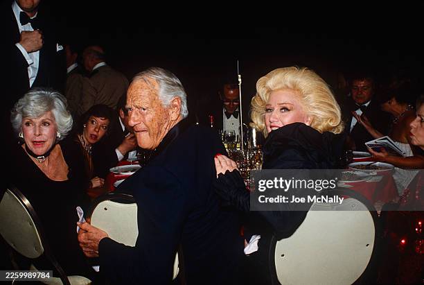 Ginger Rogers with Douglas Fairbanks and other guests at the "Night of 100 Stars", held at Radio City Music Hall in NYC, NY, on February 19 to...