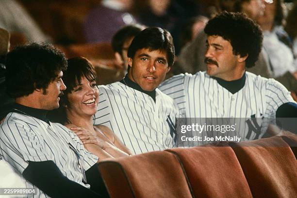 Yankees Don Mattingly, Bucky Dent, and Ron Guidry sit with Liza Minnelli at the "Night of 100 Stars", held at Radio City Music Hall in NYC, NY, on...