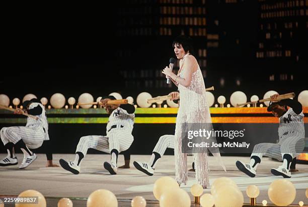 Liza Minelli and some members of the NY Yankees baseball team perform on stage at the "Night of 100 Stars", held at Radio City Music Hall in NYC, NY,...