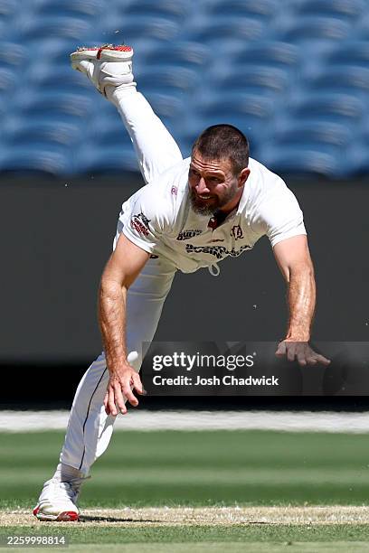 Michael Neser of the Bulls bowls during day one of the Sheffield Shield match between Victoria and Queensland at Melbourne Cricket Ground, on...