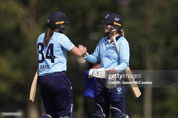 Lauren Cheatle and Sam Bates of the Breakers celebrate victory during the WNCL match between New South Wales Breakers and Queensland Fire at Cricket...