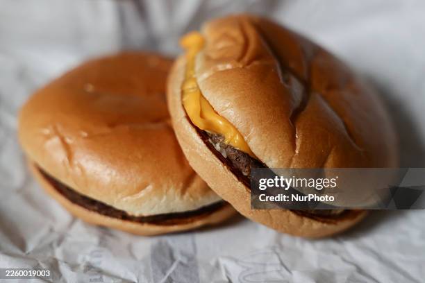 McDonald's Cheeseburger and Hamburger are seen in this illustration photo taken in Krakow, Poland on February 8, 2026.