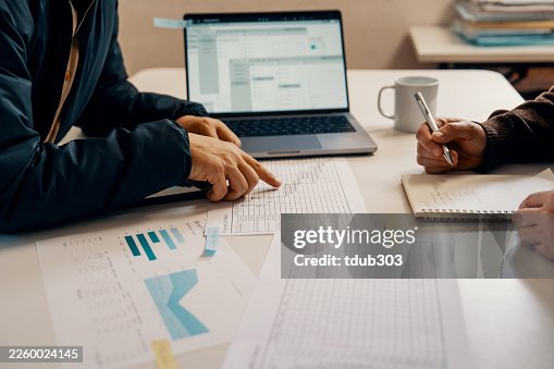 Close up shot of an accountant or financial advisor having casual meeting with client Close up shot of an accountant or financial advisor having casual meeting with client