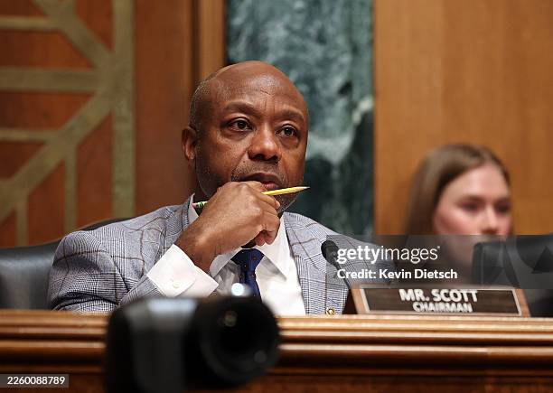 Chair of the Senate Committee on Banking, Housing, and Urban Affairs Sen. Tim Scott questions U.S. Treasury Secretary Scott Bessent during a hearing...