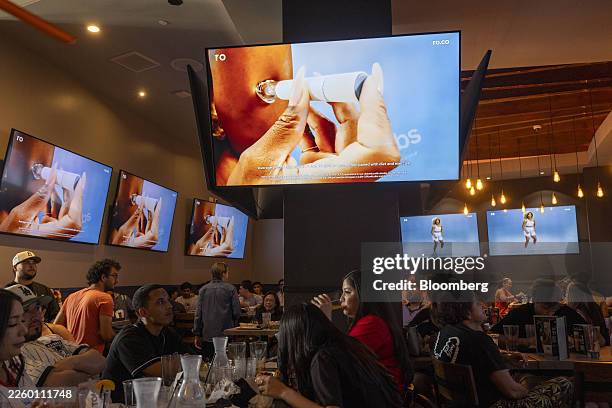 Commercial for GLP-1 drugs during the Super Bowl LX broadcast on television screens at a bar in Los Angeles, California, US, on Sunday, Feb. 8, 2026....