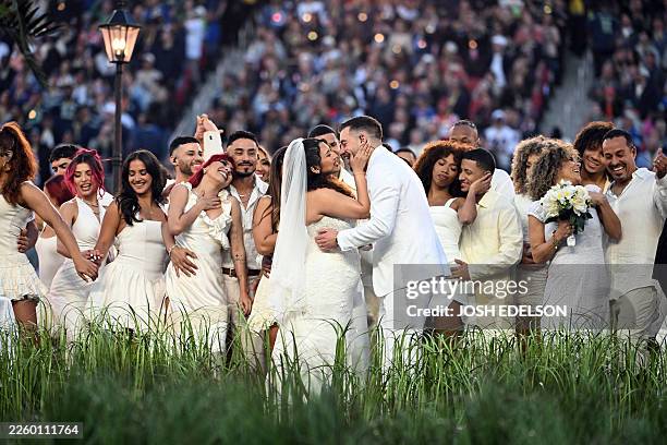 Couple gets married live on stage during Puerto Rican singer Bad Bunny's performance at Super Bowl LX Patriots vs Seahawks Apple Music Halftime Show...