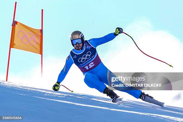 Italy's Dominik Paris competes in the downhill run of the men's team combined alpine skiing event during the Milano Cortina 2026 Winter Olympic Games...