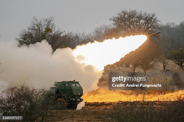 Soldiers use a High Mobility Artillery Rocket System launcher on February 9, 2026 in Cincu, Romania. Dynamic Front 26 is the largest U.S. Army-led...