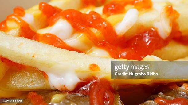 close up of french fries with tomato ketchup and mayonnaise - fast food french fries stock pictures, royalty-free photos & images
