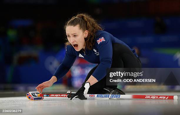 Britain's Jennifer Dodds competes in the curling mixed doubles round robin semi-final between Great Britain and Sweden during the Milano Cortina 2026...