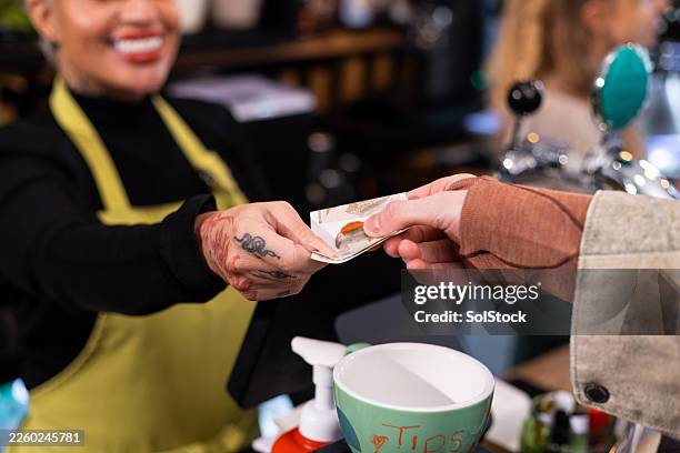 paying with cash - banknote stock pictures, royalty-free photos & images