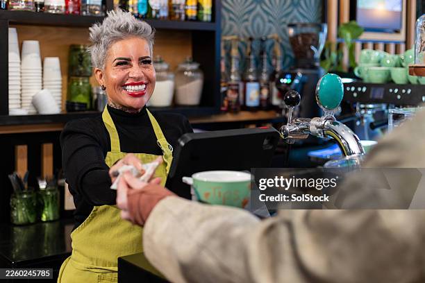 paying for a coffee - customer experience stock pictures, royalty-free photos & images