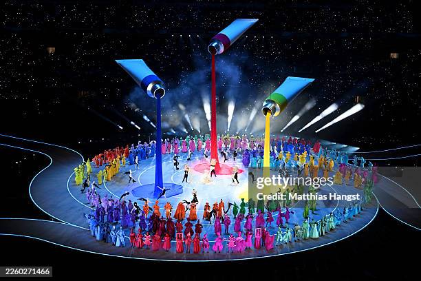 General view of a parade of performers dressed as symbols of Italian imagination and creativity during the opening ceremony of the Milano Cortina...