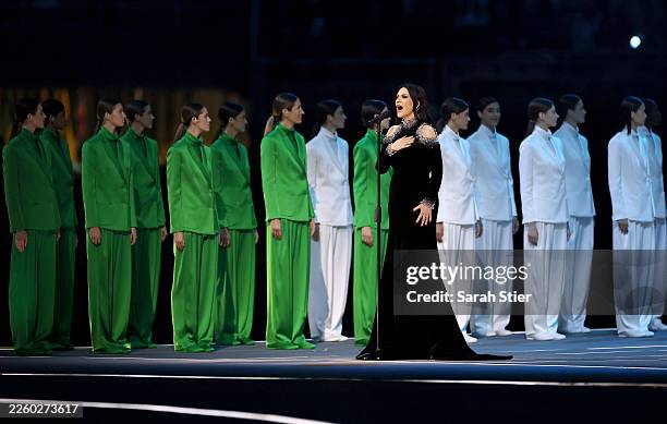 Laura Pausini performs the national anthem during the opening ceremony of the Milano Cortina 2026 Winter Olympics at San Siro Stadium on February 06,...
