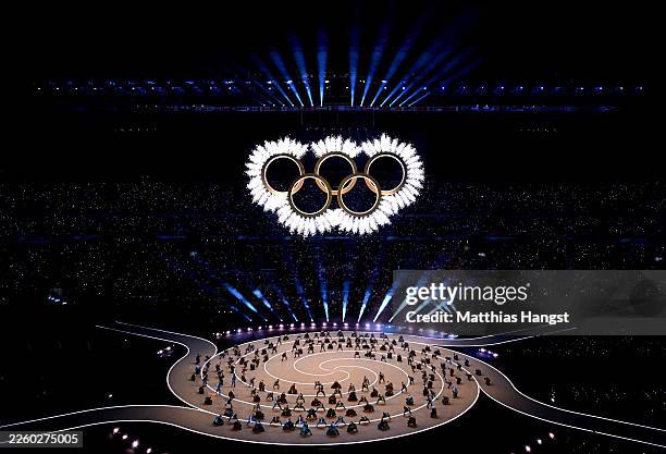 General view as the Olympic rings come together for a fireworks display during the opening ceremony of the Milano Cortina 2026 Winter Olympics at San...
