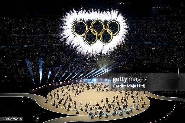 General view as the Olympic rings come together for a fireworks display during the opening ceremony of the Milano Cortina 2026 Winter Olympics at San...