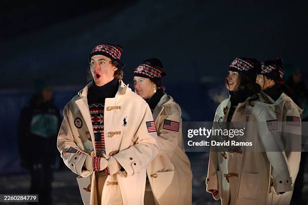 Athletes of Team United States walk in the parade during the opening ceremony of the Milano Cortina 2026 Winter Olympics at Livigno Snow Park on...