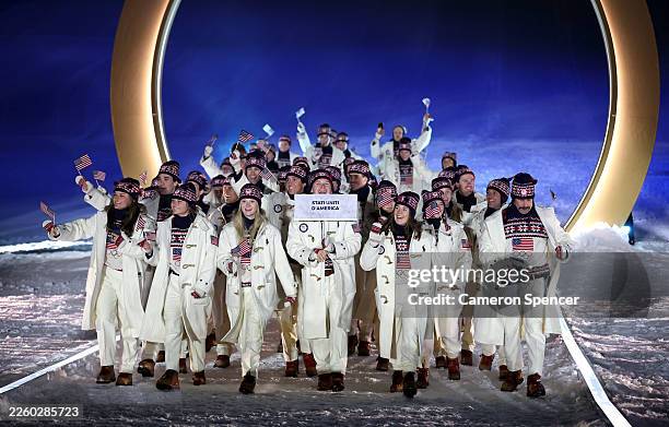 Athletes of Team United States enter into the parade during the opening ceremony of the Milano Cortina 2026 Winter Olympics at Livigno Snow Park on...