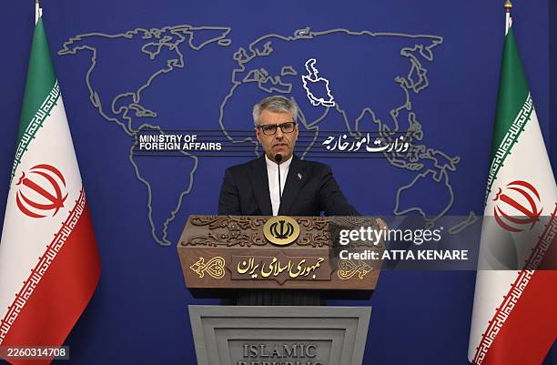Iranian foreign ministry spokesman Esmail Baqaei responds to reporters on his country's foreign policy agenda and regional developments during the...
