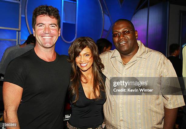 S American Idol judges Simon Cowell, Paula Abdul and Randy Jackson pse peaceably at the FOX 2002 SummerTCA Tour at the Huntington Ritz Carlton Hotel...