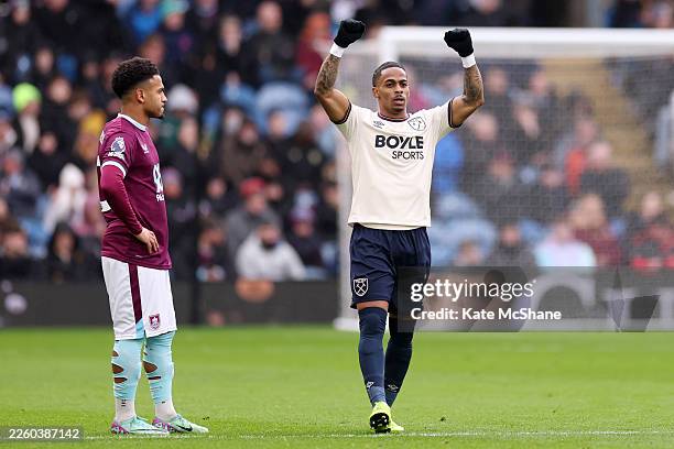 Crysencio Summerville of West Ham United celebrates scoring his team's first goal as Marcus Edwards of Burnley looks dejected during the Premier...