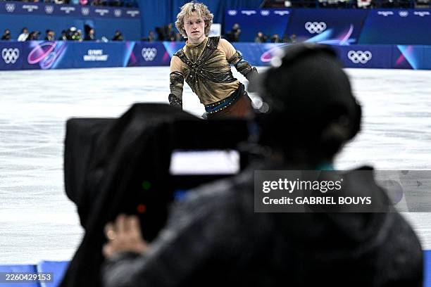 S Ilia Malinin warms up in front of a cameraman ahead of the figure skating men's singles short program during the Milano Cortina 2026 Winter Olympic...