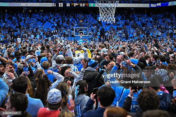 North Carolina Tar Heels fans storm the floor after a win against the Duke Blue Devils at Dean E. Smith Center on February 07, 2026 in Chapel Hill,...