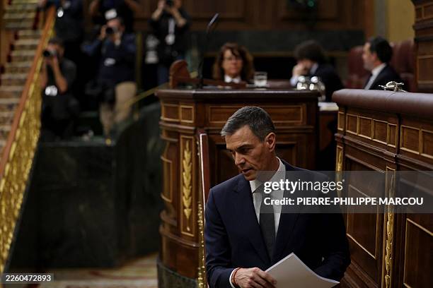 Spain's Prime minister Pedro Sanchez leaves after addressing parliament over January train tragedy at the congress in Madrid on February 11, 2026....