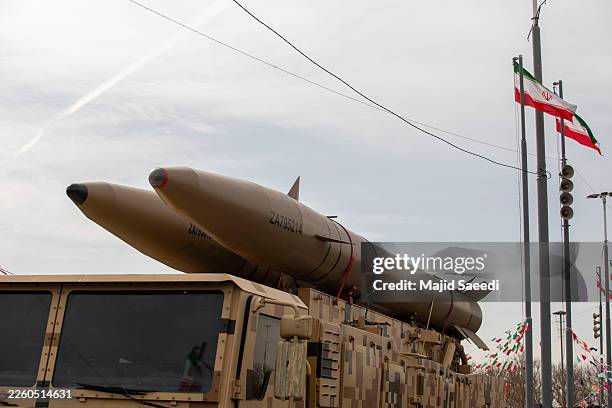 Missiles produced by Iran's armed forces are displayed during commemorations to mark the anniversary of the 1979 Iranian Revolution on February 11,...