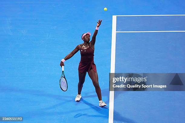 Victoria Mboko of Canada serves against Marie Bouzkova of the Czech Republic during day one of the Qatar TotalEnergies Open, part of the Hologic WTA...