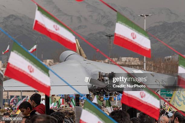 An Iran-made unmanned aerial vehicle , the Shahed-136, is displayed in a rally commemorating the 47th anniversary of the Islamic Revolution's victory...