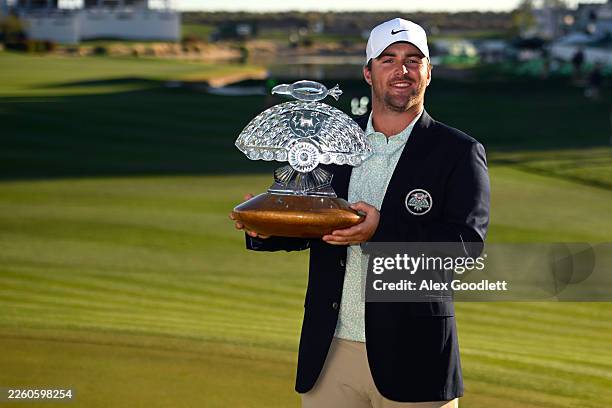 Chris Gotterup of the United States poses with the winner's trophy after winning the WM Phoenix Open 2026 at TPC Scottsdale on February 08, 2026 in...