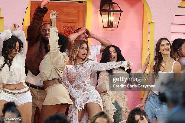 Karol G, Cardi B and Jessica Alba perform onstage during the Apple Music Super Bowl LX Halftime Show at Levi's Stadium on February 08, 2026 in Santa...