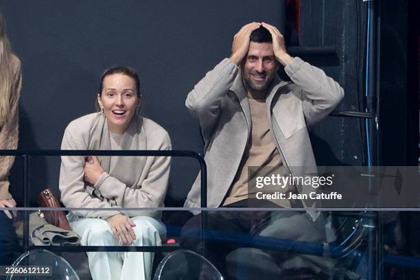 Novak Djokovic and his wife Jelena Djokovic react to the backflip of Ilia Malinin of USA during the Figure Skating Team Event on day two of the...
