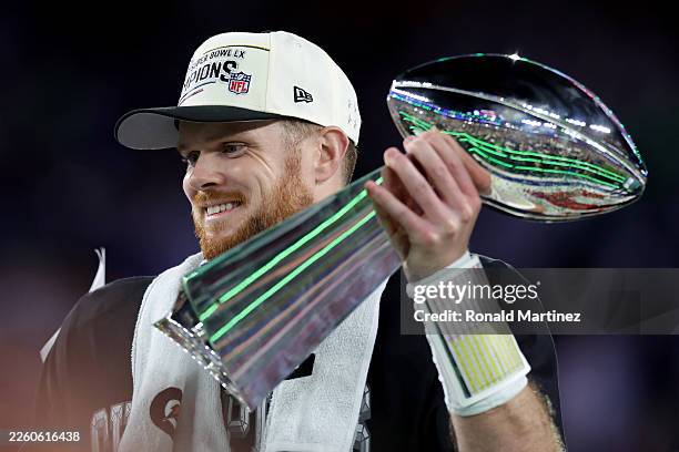 Sam Darnold of the Seattle Seahawks celebrates with the Vince Lombardi Trophy after winning Super Bowl LX against the New England Patriots at Levi's...