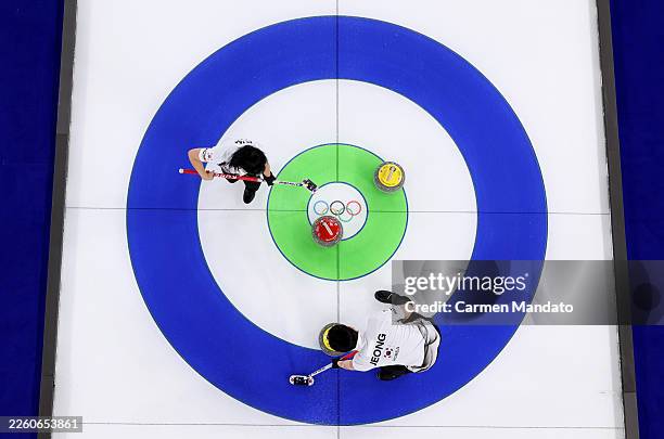 Seonyeong Kim of Team Republic of Korea and Yeongseok Jeong compete against Team Norway during mixed doubles round robin on day three of the Milano...