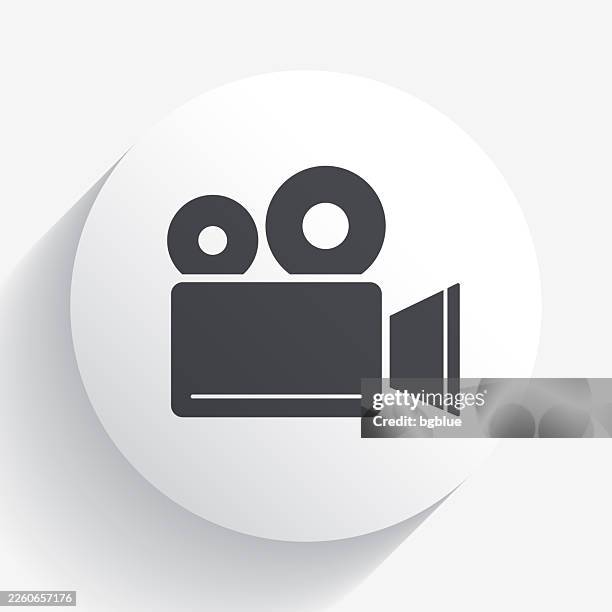 movie camera. icon on circle button with long shadow - vintage television white background stock illustrations