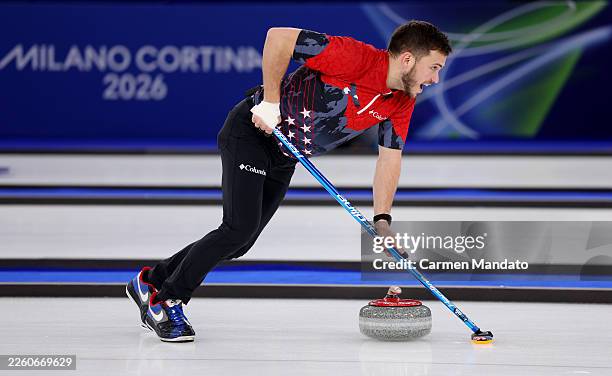 Korey Dropkin of Team United States competes alongside Cory Thiesse of Team United States in their match against Team Italy during mixed doubles...