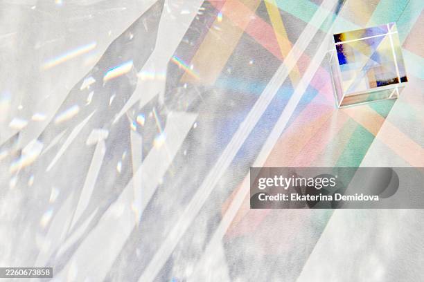 glass cube prism refracting light creating colorful spectrum - crystal cube stock pictures, royalty-free photos & images