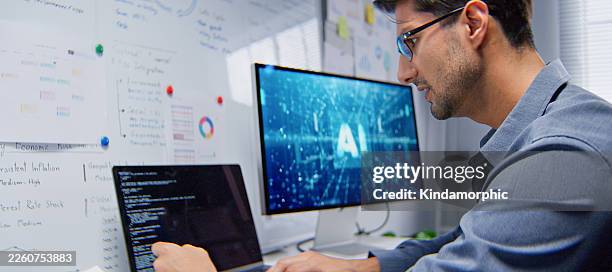 white latin male software engineer developer, coding ai program on laptop computer at home office at night. internet information technology. programmer freelance job, artificial intelligence at work - virtual assistant stock pictures, royalty-free photos & images