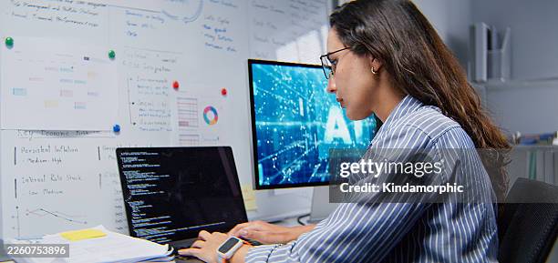 white latin female software engineer developer, coding ai program on laptop computer at home office at night. internet information technology. programmer freelance job, artificial intelligence at work - virtual assistant stock pictures, royalty-free photos & images