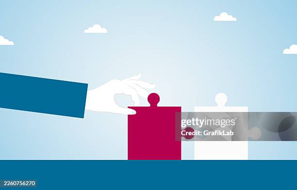 strategic partnership and merger. hand connecting red and white puzzle pieces - integrated marketing strategy stock illustrations