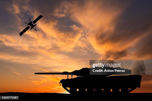 armored tank and satellite at sunset - defense industry stock pictures, royalty-free photos & images