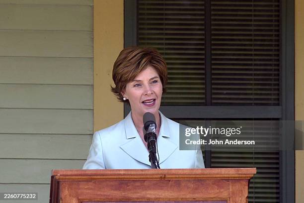 View of US First Lady Laura Bush as she speaks from a lectern during a National Literary Landmark dedication ceremony for the Katherine Anne Porter...