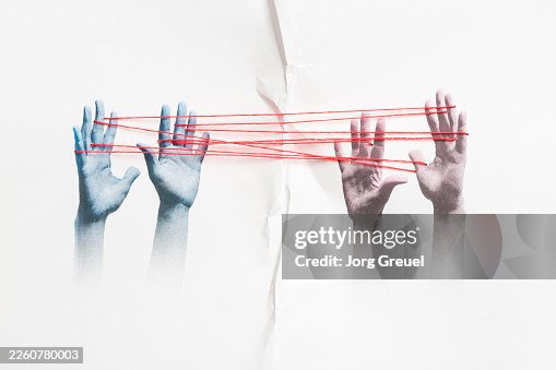 Hands connected by a string Hands connected by a string