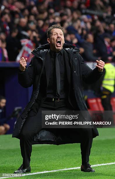 Atletico Madrid's Argentine coach Diego Simeone celebrates his team's third goal scored by Atletico Madrid's English forward Ademola Lookman during...